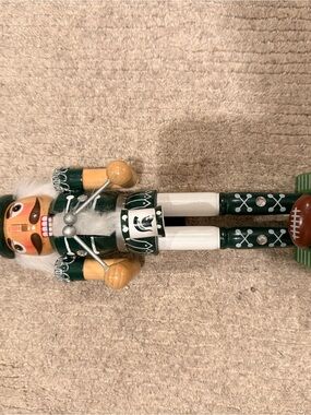 Green and White Football Nutcracker